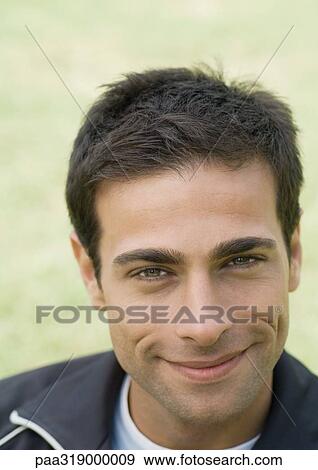 Young man smiling, portrait View Large Photo Image Stock Photo - Young man smiling, portrait. Fotosearch