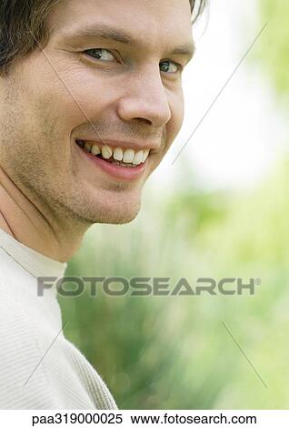 Young man smiling, portrait View Large Photo Image Stock Photography - Young man smiling, portrait. Fotosearch