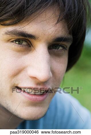 Young man's face, portrait View Large Photo Image Stock Photograph - Young man's face, portrait. Fotosearch