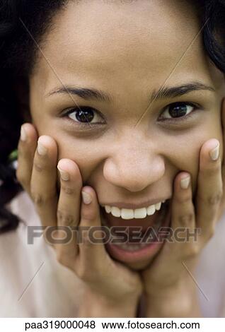 Stock Photo - Young woman with surprised expression. Fotosearch