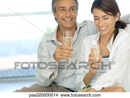 Mature couple with champagne View Large Photo Image Picture - Mature couple with champagne. Fotosearch
