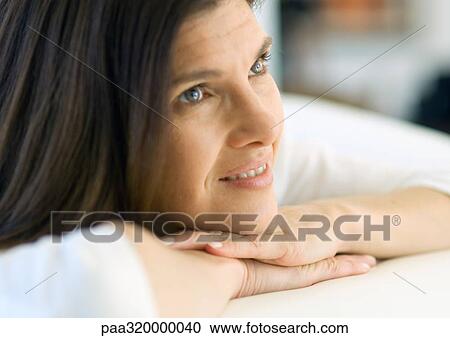 Mature woman resting head on hands and smiling, portrait View Large Photo Image Stock Image - Mature woman resting head on hands and smiling, portrait. Fotosearch