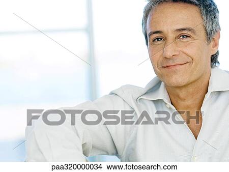 Picture - Mid-adult man smiling, portrait. Fotosearch