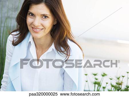 Mid-adult woman smiling View Large Photo Image Stock Photography - Mid-adult woman smiling. Fotosearch