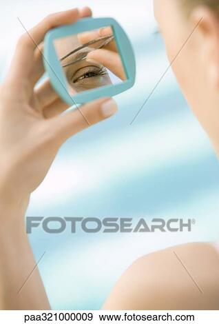 Woman tweezing brows View Large Photo Image Stock Photo - Woman tweezing brows. Fotosearch