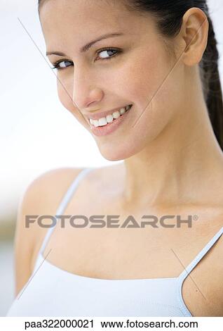 Stock Image - Woman smiling, portrait. Fotosearch