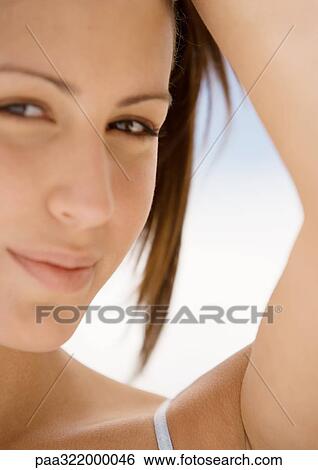 Woman with arm up, close-up View Large Photo Image Stock Photograph - Woman with arm up, close-up. Fotosearch