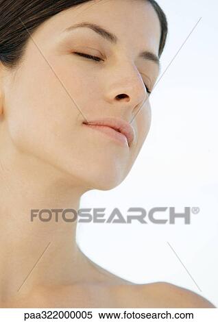 Stock Photography - Woman with eyes closed, portrait. Fotosearch