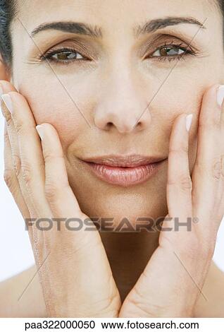 Woman with hands on cheeks View Large Photo Image Stock Image - Woman with hands on cheeks. Fotosearch