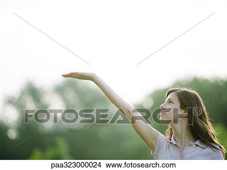 Woman holding palm up View Large Photo Image Picture - Woman holding palm up. Fotosearch