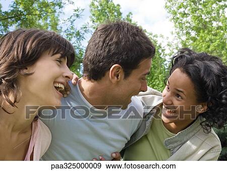 Three friends laughing View Large Photo Image Stock Photo - Three friends laughing. Fotosearch