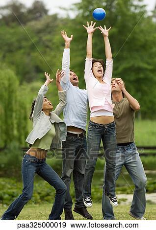 Young people jumping for ball View Large Photo Image Stock Photo - Young people jumping for ball. Fotosearch