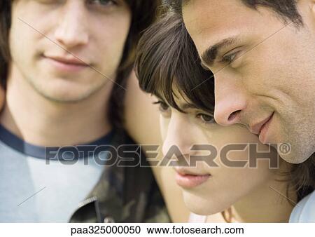 Young woman between two male friends View Large Photo Image Stock Image - Young woman between two male friends. Fotosearch