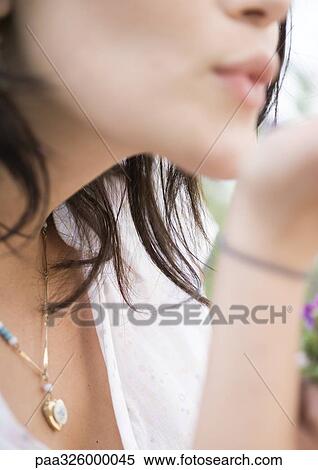 Woman blowing kiss, close-up View Large Photo Image Stock Photography - Woman blowing kiss, close-up. Fotosearch