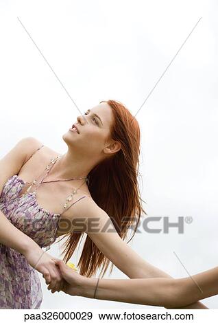 Young woman holding friend's hand View Large Photo Image Stock Photo - Young woman holding friend's hand. Fotosearch