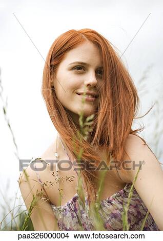 Young woman in grass View Large Photo Image Picture - Young woman in grass. Fotosearch
