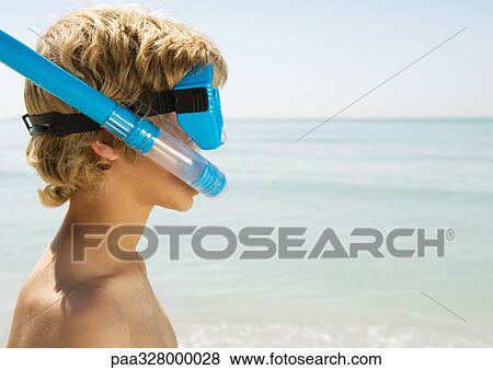 Boy wearing snorkel and scuba mask, at beach View Large Photo Image Stock Photo - Boy wearing snorkel and scuba mask, at beach. Fotosearch