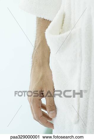 Close-up of man's hand next to bathrobe View Large Photo Image Stock Image - Close-up of man's hand next to bathrobe. Fotosearch