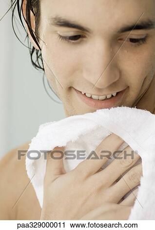 Man smiling and drying off with towel, close-up View Large Photo Image Stock Image - Man smiling and drying off with towel, close-up. Fotosearch