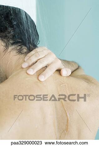 Man touching neck in shower View Large Photo Image Stock Image - Man touching neck in shower. Fotosearch