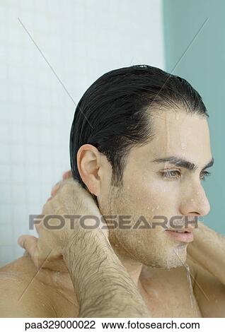 Man with hands behind neck in shower View Large Photo Image Stock Image - Man with hands behind neck in shower. Fotosearch