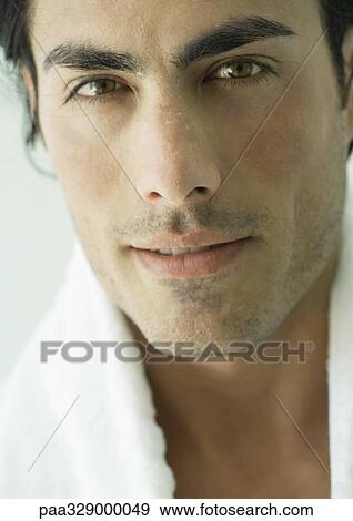 Man with towel around neck, close-up View Large Photo Image Stock Photo - Man with towel around neck, close-up. Fotosearch