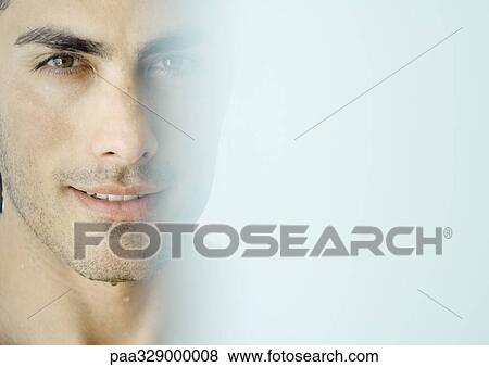 Stock Photo - Man's face, blur in foreground. Fotosearch