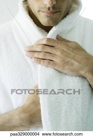 Picture - Man's hand holding bathrobe collar. Fotosearch