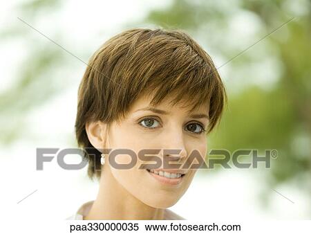 Stock Photography - Woman smiling, portrait. Fotosearch