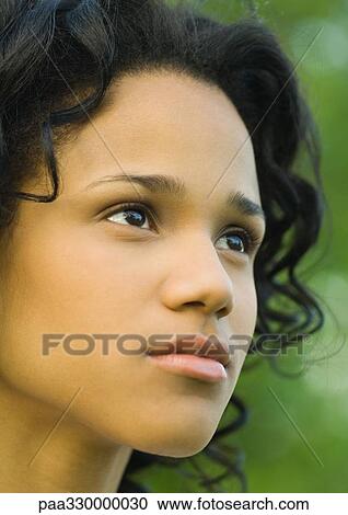 Woman's face, looking into distance View Large Photo Image Stock Image - Woman's face, looking into distance. Fotosearch