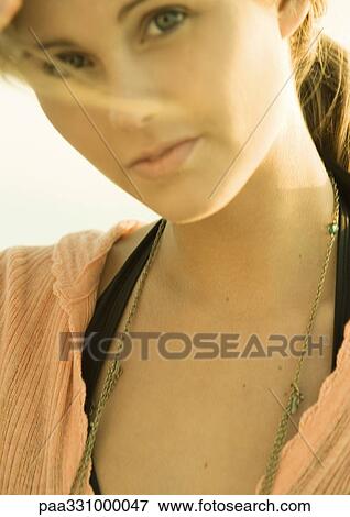 Stock Photo - Woman looking at camera. Fotosearch