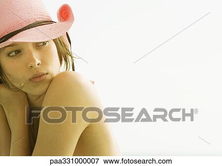 Stock Photo - Woman wearing cowboy hat. Fotosearch