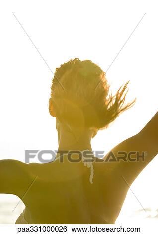 Woman wearing halter top in sun, rear view View Large Photo Image Stock Photograph - Woman wearing halter top in sun, rear view. Fotosearch
