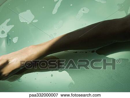 Female legs in bath water View Large Photo Image Stock Photo - Female legs in bath water. Fotosearch