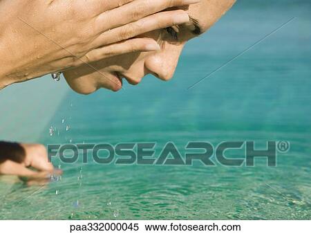 Woman splashing face with water View Large Photo Image Stock Photography - Woman splashing face with water. Fotosearch