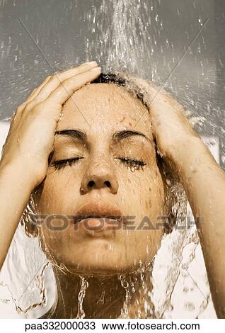 Woman's face under shower, eyes closed and hands on head View Large Photo Image Stock Image - Woman's face under shower, eyes closed and hands on head. Fotosearch