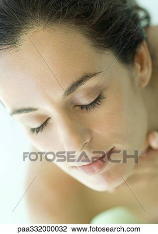 Stock Image - Woman's face with eyes closed. Fotosearch