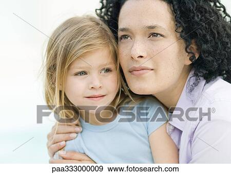 Stock Photo - Woman and girl, portrait. Fotosearch