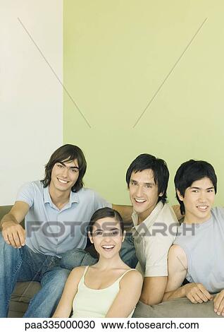 Four young adult friends smiling View Large Photo Image Stock Image - Four young adult friends smiling. Fotosearch