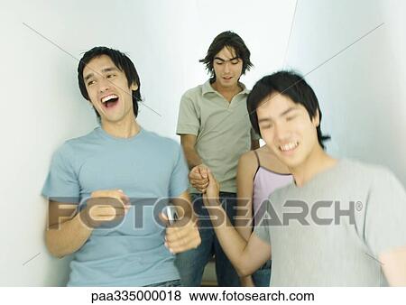 Group of young adult friends going down stairs together View Large Photo Image Stock Photo - Group of young adult friends going down stairs together. Fotosearch