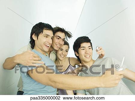 Taking group photo with cell phone View Large Photo Image Stock Image - Taking group photo with cell phone. Fotosearch