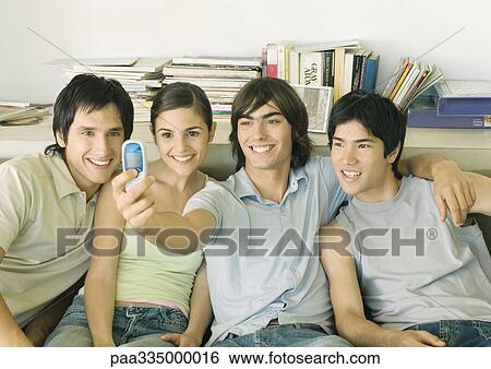 Taking group photo with cell phone View Large Photo Image Stock Photograph - Taking group photo with cell phone. Fotosearch