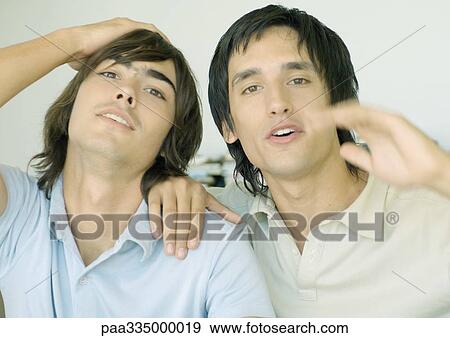 Two young men having emotional reaction View Large Photo Image Stock Photo - Two young men having emotional reaction. Fotosearch