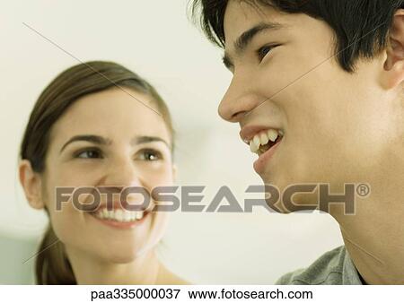 Stock Photo - Young couple smiling. Fotosearch