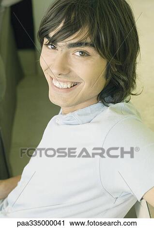 Young man smiling View Large Photo Image Stock Image - Young man smiling. Fotosearch