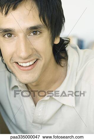 Stock Photo - Young man smiling. Fotosearch