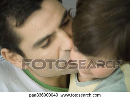 Father kissing his son on the cheek, closed eyes, portrait, extreme close-up, blur View Large Photo Image Stock Photo - Father kissing his son on the cheek, closed eyes, portrait, extreme close-up, blur. Fotosearch