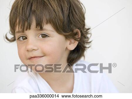 Mischievous boy looking at camera, portrait, close-up View Large Photo Image Picture - Mischievous boy looking at camera, portrait, close-up. Fotosearch