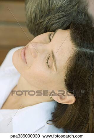 Woman sitting with head back beside man, close-up, portrait View Large Photo Image Stock Image - Woman sitting with head back beside man, close-up, portrait. Fotosearch