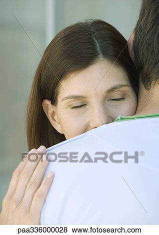 Woman with head on man's shoulder, closed eyes, partial view View Large Photo Image Stock Photo - Woman with head on man's shoulder, closed eyes, partial view. Fotosearch